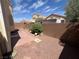 Low maintenance backyard featuring hardscape, desert landscaping and mature trees for shaded privacy at 2694 Hillgrass Rd, Las Vegas, NV 89123
