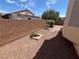 A low-maintenance backyard with decorative desert landscaping for an easy to care for outdoor space at 2694 Hillgrass Rd, Las Vegas, NV 89123