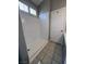 Clean and bright walk-in shower with white walls and tiled floor at 2694 Hillgrass Rd, Las Vegas, NV 89123