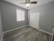 Bedroom featuring a ceiling fan, window, and closet doors at 2694 Hillgrass Rd, Las Vegas, NV 89123