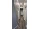 Bright hallway featuring modern wood-look flooring and neutral wall paint at 2694 Hillgrass Rd, Las Vegas, NV 89123