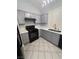 Well-lit kitchen featuring modern appliances, gray cabinets, and ample counter space at 2694 Hillgrass Rd, Las Vegas, NV 89123
