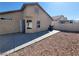 Back exterior view showcasing the patio and low-maintenance desert landscaping at 2711 Morning Break Ct, Las Vegas, NV 89142