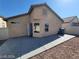 Back exterior view showcasing the patio and low-maintenance desert landscaping at 2711 Morning Break Ct, Las Vegas, NV 89142