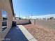 Spacious backyard featuring a concrete patio and low-maintenance desert landscaping at 2711 Morning Break Ct, Las Vegas, NV 89142