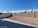 Spacious backyard featuring a concrete patio and low-maintenance desert landscaping at 2711 Morning Break Ct, Las Vegas, NV 89142