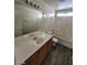Bathroom features a tub and shower combo, a single-sink vanity, and a built-in medicine cabinet mirror at 2711 Morning Break Ct, Las Vegas, NV 89142