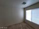 Bright bedroom with natural light from window and neutral carpeting at 2711 Morning Break Ct, Las Vegas, NV 89142