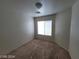 Comfortable bedroom with natural light from window and neutral carpeting at 2711 Morning Break Ct, Las Vegas, NV 89142