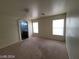 This bedroom offers natural light from two windows and features an en-suite bathroom at 2711 Morning Break Ct, Las Vegas, NV 89142