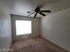 Bedroom featuring a ceiling fan, neutral carpeting, and natural light at 2711 Morning Break Ct, Las Vegas, NV 89142