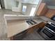 Well-lit kitchen featuring stainless steel appliances, wood cabinets, and a stainless-steel sink at 2711 Morning Break Ct, Las Vegas, NV 89142