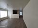 Open-concept living room with hardwood flooring leading into kitchen area at 2711 Morning Break Ct, Las Vegas, NV 89142