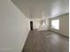 Inviting living room with new hardwood flooring and ample natural light from large window at 2711 Morning Break Ct, Las Vegas, NV 89142