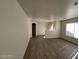Inviting living room with new hardwood flooring and ample natural light from large window at 2711 Morning Break Ct, Las Vegas, NV 89142