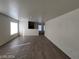 Spacious living room with neutral paint and sleek hardwood flooring at 2711 Morning Break Ct, Las Vegas, NV 89142