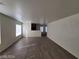 Spacious living room with neutral paint and sleek hardwood flooring at 2711 Morning Break Ct, Las Vegas, NV 89142