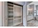Open closet featuring shelving next to a bathroom with a modern vanity at 2741 Chokecherry Ave, Henderson, NV 89074