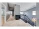 Upstairs hallway with neutral carpet and views of the staircase at 2741 Chokecherry Ave, Henderson, NV 89074