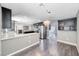Spacious kitchen with stainless appliances, stone backsplash and open floor plan to the living room at 2741 Chokecherry Ave, Henderson, NV 89074