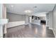 Open concept living room with wood floors leading to the kitchen at 2741 Chokecherry Ave, Henderson, NV 89074