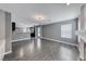 Bright open concept living room features wood floors and access to the kitchen at 2741 Chokecherry Ave, Henderson, NV 89074