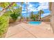 Backyard featuring an in-ground pool surrounded by a concrete patio and desert landscaping at 2741 Chokecherry Ave, Henderson, NV 89074