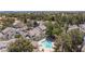 This is a beautiful aerial view of the exterior and the sparkling swimming pool in the backyard of this community at 2749 Lodestone Dr, Las Vegas, NV 89117