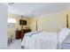 Bedroom with four-poster bed, TV, dresser, and a window for natural light at 2749 Lodestone Dr, Las Vegas, NV 89117