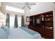 Primary bedroom with a ceiling fan, sliding glass door, and built-in dresser at 2749 Lodestone Dr, Las Vegas, NV 89117