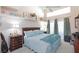 Vaulted ceiling bedroom with a ceiling fan, slider door, and large bed at 2749 Lodestone Dr, Las Vegas, NV 89117
