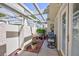 Outdoor patio with stone supports, garden area, and seating, providing a serene retreat at 2749 Lodestone Dr, Las Vegas, NV 89117