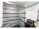 Accessible shower with grab bars, a seat, and a glass door at 2749 Lodestone Dr, Las Vegas, NV 89117
