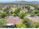 Aerial view of the community showcasing houses, a golf course, and distant mountains at 2836 Linkview Dr, Las Vegas, NV 89134