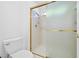 Walk-in shower features glass doors with gold trim, and is accompanied by a toilet at 2836 Linkview Dr, Las Vegas, NV 89134