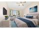 Bright bedroom boasts a bay window seating area, vaulted ceiling, and a ceiling fan for comfortable living at 2836 Linkview Dr, Las Vegas, NV 89134