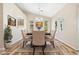 Dining room with updated flooring, neutral paint, and stylish light fixture at 2836 Linkview Dr, Las Vegas, NV 89134
