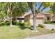 Inviting home exterior with well-manicured lawn, mature trees, and a welcoming facade at 2836 Linkview Dr, Las Vegas, NV 89134