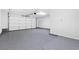 Spacious two car garage featuring epoxy floors and an automatic garage door at 2836 Linkview Dr, Las Vegas, NV 89134