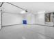 Spacious two car garage featuring epoxy floors and utility access at 2836 Linkview Dr, Las Vegas, NV 89134