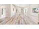 Bright living room with wood-look floors and unique architectural details at 2836 Linkview Dr, Las Vegas, NV 89134
