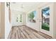 Bright sunroom with hardwood floors, neutral walls, and sliding glass door at 2836 Linkview Dr, Las Vegas, NV 89134