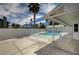 Inviting backyard pool area, surrounded by a privacy fence and mature trees, provides a serene escape at 3143 El Chico Ct, Las Vegas, NV 89120