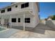 The backyard features a pool, covered patio, and lush greenery, perfect for outdoor enjoyment and relaxation at 3143 El Chico Ct, Las Vegas, NV 89120