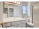The bathroom features a vanity, toilet, shower and window at 3143 El Chico Ct, Las Vegas, NV 89120