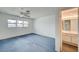 Bedroom with blue carpet and vanity area at 3143 El Chico Ct, Las Vegas, NV 89120