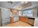 Inviting kitchen area with stainless steel appliances, light wood cabinets, and open access to living area at 3143 El Chico Ct, Las Vegas, NV 89120