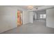 Open-concept living space with access to the kitchen and a view of the home's entrance at 3143 El Chico Ct, Las Vegas, NV 89120
