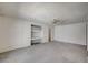 Spacious and bright living room with ceiling fan and built-in shelving at 3143 El Chico Ct, Las Vegas, NV 89120