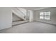Spacious Living Room with staircase and large window at 3143 El Chico Ct, Las Vegas, NV 89120